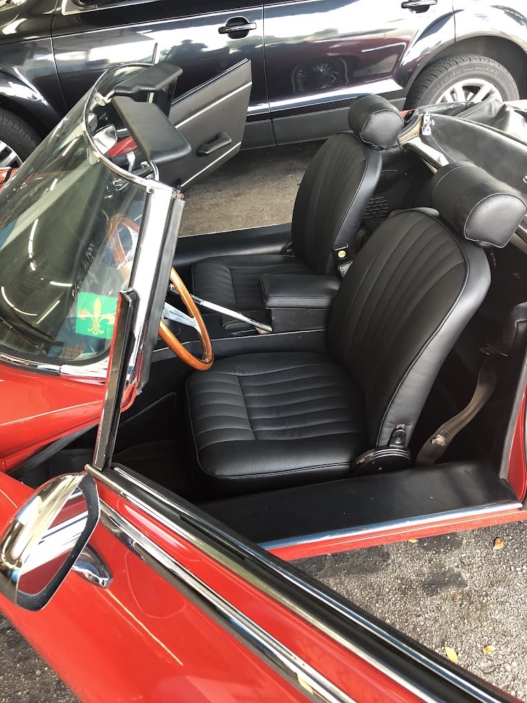 Red car with black leather seat restoration Miami
